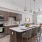 Quartz countertops and dark cabinets in apartment kitchen