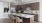 Kitchen island with pendant lighting and barstools