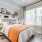 Vinyl flooring in bedroom with large window and bed